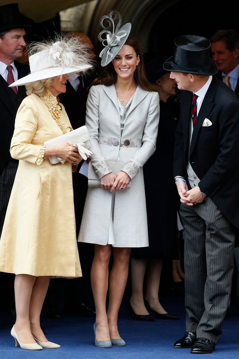 WINDSOR, ENGLAND - JUNE 13:   Camilla, Duchess of Cornwall (L), Catherine, Duchess of Cambridge (C) and Edward Stanley, Earl of Derby watch the Garter Service pass by on June 13, 2011 in Windsor, England. The Order of the Garter is the senior and oldest British Order of Chivalry, founded by Edward III in 1348. Membership in the order is limited to the sovereign, the Prince of Wales, and no more than twenty-four members. (Photo by Kirsty Wigglesworth/WPA Pool/ Getty Imagesl)