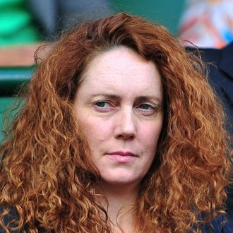 A picture taken on July 1, 2011 shows Chief Executive of News International, and former editor of Britain's News of the World newspaper, Rebekah Brooks, at the men's single semi final at the Wimbledon Tennis Championships in London. British police on July 17, 2011 arrested Rebekah Brooks, the former head of media mogul Rupert Murdoch's British newspaper wing, over the phone hacking scandal, British media reported. Scotland Yard said in a statement that a 43-year-old woman had been arrested over allegations of phone hacking and corruption. They would not confirm it was Brooks, 43, and there was no immediate comment from News International. AFP PHOTO / LEON NEAL - RESTRICTED TO EDITORIAL USE (Photo credit should read LEON NEAL/AFP/Getty Images)