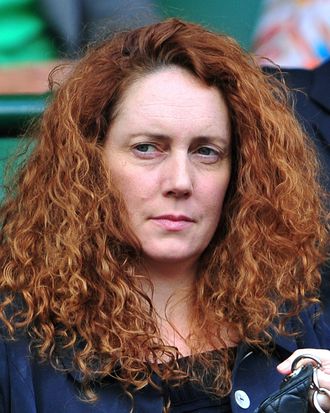 A picture taken on July 1, 2011 shows Chief Executive of News International, and former editor of Britain's News of the World newspaper, Rebekah Brooks, at the men's single semi final at the Wimbledon Tennis Championships in London. British police on July 17, 2011 arrested Rebekah Brooks, the former head of media mogul Rupert Murdoch's British newspaper wing, over the phone hacking scandal, British media reported. Scotland Yard said in a statement that a 43-year-old woman had been arrested over allegations of phone hacking and corruption. They would not confirm it was Brooks, 43, and there was no immediate comment from News International. AFP PHOTO / LEON NEAL - RESTRICTED TO EDITORIAL USE (Photo credit should read LEON NEAL/AFP/Getty Images)