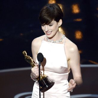 Actress Anne Hathaway accepts the Best Supporting Actress award for 