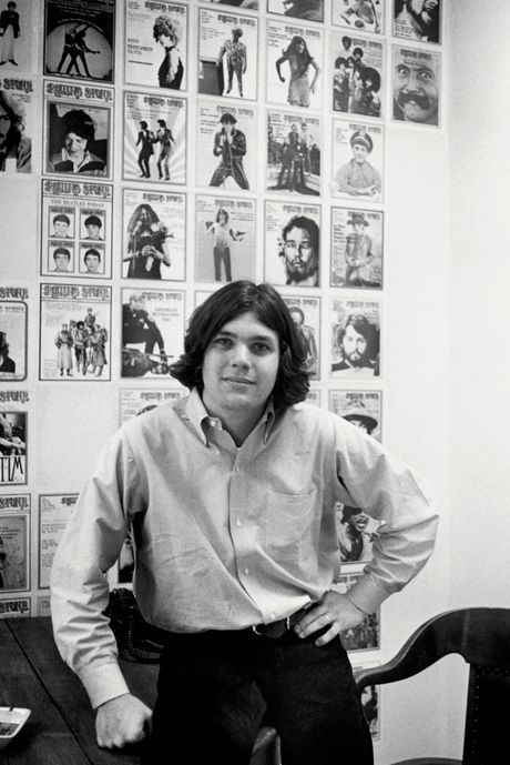 Jann Wenner Posing with Rolling Stone Covers
