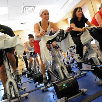 People in a spinning class at a New York Sports Clubs gym.