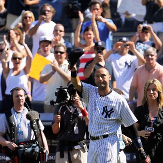 NEW YORK, NY - JULY 09: Derek Jeter #2 of the New York Yankees waves to the fans after a game in which he hit his 3000th career hit while playing against the Tampa Bay Rays at Yankee Stadium on July 9, 2011 in the Bronx borough of New York City. (Photo by Michael Heiman/Getty Images)