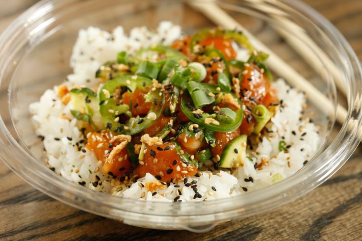 Heat Wave over white rice: salmon, cucumber, jalapeños, scallions, herb mix, spicy citrus, shoyu.