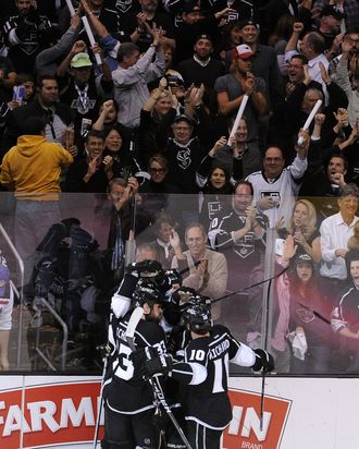 (L-R) Willie Mitchell #33, Jeff Carter #77, Slava Voynov #26, Dustin Penner #25 and Mike Richards #10 of the Los Angeles Kings celebrate Carter's goal in the third period against the New Jersey Devils in Game Three of the 2012 Stanley Cup Final