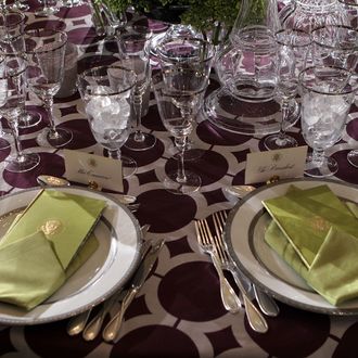 WASHINGTON, DC - MARCH 14: Table setting is seen during a press preview of the state dinner in honor of British Prime Minister David Cameron and Mrs. Cameron March 14, 2012 in the State Dining Room of the White House in Washington, DC. First lady Michelle Obama spoke to female students from the United States and United Kingdom about the importance of this official visit at the event. (Photo by Alex Wong/Getty Images)