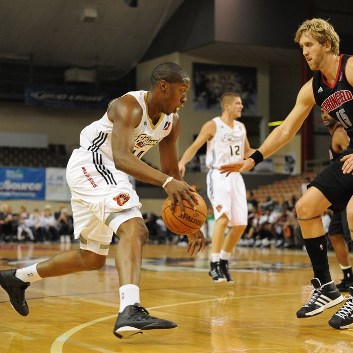 Tasmin Mitchell #14 of the Erie Bayhawks looks to move the ball against Mike Williams #15 of the Springfield Armor during a NBA D-League game on November 20, 2010 at the Tullio Arena in Erie, Pennsylvania. 