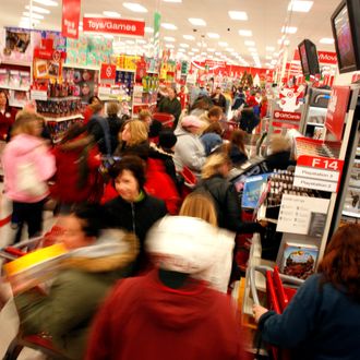 PLEASANT PRAIRIE, WI - NOVEMBER 28: Holiday shoppers race around for gifts after braving the cold temperatures out side of Target as they start the traditional holiday shopping season November 28, 2008 in Pleasant Prairie, Wisconsin. The day after Thanksgiving is typically the busiest shopping day of the year and traditionally a indicator of the economy and how the holiday shopping season will go. (Photo by Darren Hauck/Getty Images)