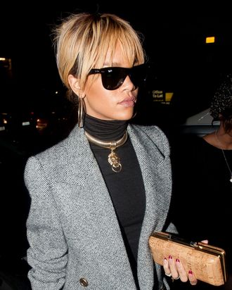 Rihanna out last night, purse at the ready.