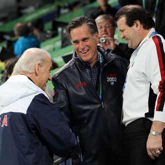 United States vice-president Joe Biden talks with former govenor Mitt Romeny and Mike Eruzione attend women's ice hockey preliminary game between United States and China at UBC Thunderbird Arena on February 14, 2010 in Vancouver, Canada.