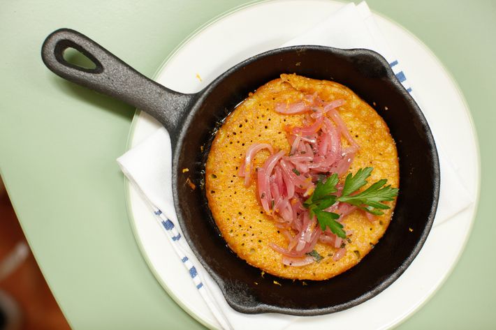 Farinata: a traditional savory pancake from Liguria. It's made from chickpea flour and topped with red onion.