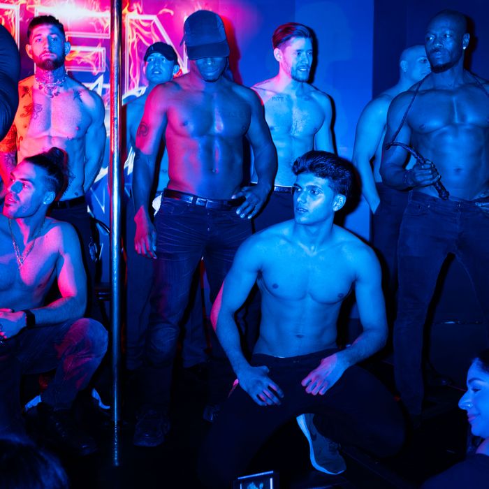 male strippers disrobe female audience members