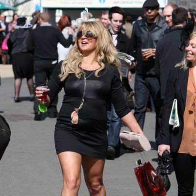 Racegoers at the 'Liverpool Day' at Aintree races as the Grand National meeting kicked off, UK