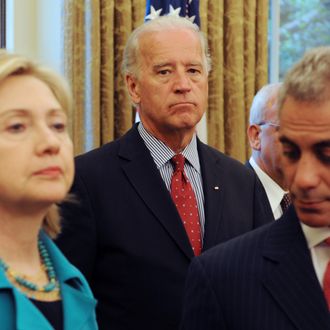 US Vice President Joe Biden (C), US Secretary of State Hillary Clinton (L) and White House Chief of Staff Rahm Emanuel (R) stand in the Oval Office of the White House while US President Barack Obama (not pictured) meets with President of Palestine Mahmoud Abbas (not pictured) May 28, 2009 in Washington DC.