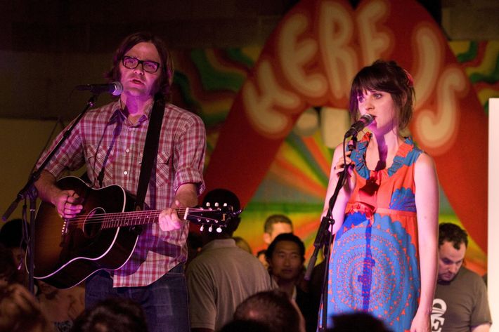 DENVER - AUGUST 27:  Ben Gibbard and Zooey Deschanel perform on the VIP stage at Unconventional '08 at the Manifest Hope Gallery on August 27, 2008 in Denver, Colorado.  (Photo by Timothy Norris/Getty Images)