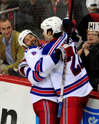 RALEIGH, NC - MARCH 01: Brandon Prust #8 and Brian Boyle #22 of the New York Rangers celebrate Prust's game-winning goal against the Carolina Hurricanes during play at the RBC Center on March 1, 2012 in Raleigh, North Carolina. Boyle assisted on the goal as the Rangers won 3-2. (Photo by Grant Halverson/Getty Images)