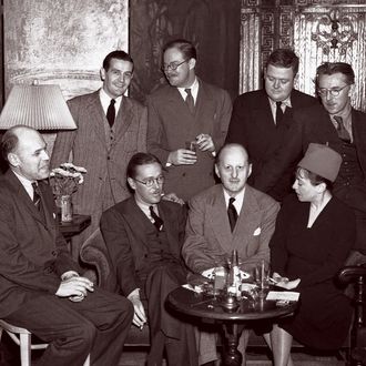 Fritz Foord, Wolcott Gibbs, Frank Case and Dorothy Parker (seated left to right) and Alan Campbell, St. Clair McKelway, Russell Maloney and James Thurber (standing left to right) at a cocktail party at the Hotel Algonquin held to celebrate the success of Case's book
