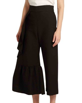 Pleated low-rise wide-leg wool pants in black - Wardrobe NYC | Mytheresa
