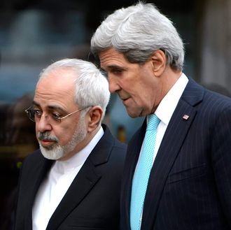 US Secretary of State John Kerry, (R), speaks with Iranian Foreign Minister Mohammad Javad Zarif, (L), as they walk in the city of Geneva, Switzerland, 14 January 2015, during a bilateral meeting ahead of the next round of nuclear discussions, which begin on 15 January. EPA/LAURENT GILLIERON --- Image by ? LAURENT GILLIERON/epa/Corbis