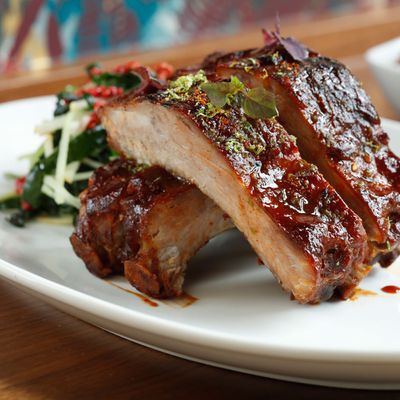Root-beer-glazed pork ribs with heirloom baked beans, Tuscan kale, and Asian-pear slaw.