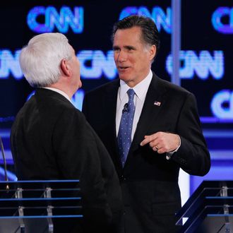 JACKSONVILLE, FL - JANUARY 26: Republican presidential candidates, former Massachusetts Gov. Mitt Romney (R) and former Speaker of the House Newt Gingrich (R-GA) visit during a commerical break in a debate sponsored by CNN, the Republican Party of Florida and the Hispanic Leadership Network at the University North Florida on January 26, 2012 in Jacksonville, Florida. The debate is the last one before the Florida primaries January 31st. (Photo by Joe Raedle/Getty Images)