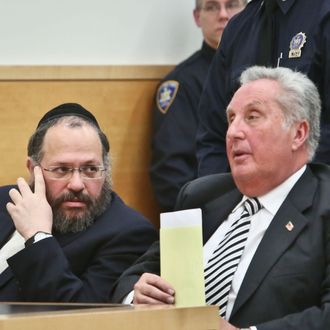Nechemya Weberman, left, a religious counselor in New York City’s ultra-orthodox Jewish community, confers with his lawyer George Farkas in Brooklyn Supreme Court, Tuesday, Jan. 22, 2013, in New York. Weberman was sentenced Tuesday to 103 years in prison for molesting a girl who came to him with questions about her faith. He was convicted in December of 59 counts, including sustained sexual abuse of a child, endangering the welfare of a child and sexual abuse. (AP Photo/Bebeto Matthews)