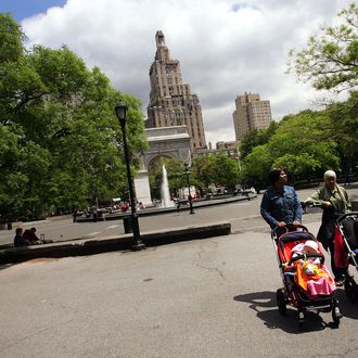 NEW YORK - MAY 23: Women push strollers through Washington Square Park May 23, 2005 in New York City. A renovation is planned for the Greenwich Village park which includes installing a perimeter fence, relocating the signature fountain by approximately 20 feet to line up with the Washington Square Arch, moving both dog runs as well as restructuring pathways. Community reaction has been mixed to the changes, but the $16 million dollar renovation is slated to begin this summer. (Photo by Chris Hondros/Getty Images)