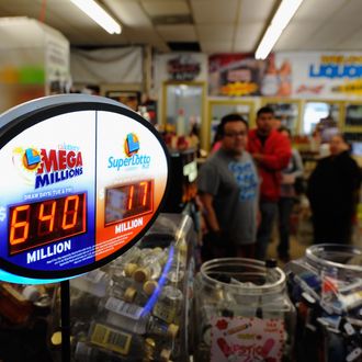 COVINA, CA - MARCH 30: A sign displays of the $640 Mega Millions jackpot at Liquorland on March 30, 2012 in Covina, California The Mega Millions jackpot has reached a high of $640 million before the drawing tonight. (Photo by Kevork Djansezian/Getty Images)