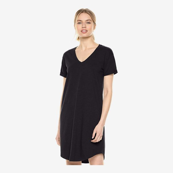 A model wearing the short Daily Ritual Women’s Lived-in Cotton Roll-Sleeve V-Neck T-Shirt Dress in black. 33 Things on Sale You’ll Actually Want to Buy: From Adidas to Le Creuset - The Strategist