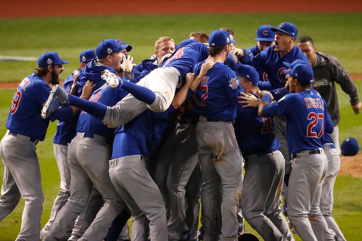 Photos of the Chicago Cubs Hugging After World Series Win