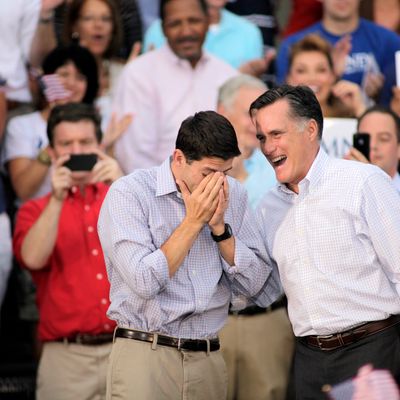 Republican vice presidential candidate and Wisconsin native Rep. Paul Ryan (R-WI) (L) wipes away tears as he and presidential candidate and former Massachusetts Gov. Mitt Romney greet supporters during a campaign event at the Waukesha Expo Center on August 12, 2012 in Waukesha, Wisconsin. Romney continues his four day bus tour a day after announcing his running mate, Rep. Paul Ryan. 