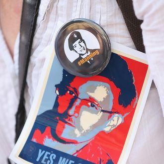 BERLIN, GERMANY - JULY 27: An activist wears pictures of whistleblowers Edward Snowden and Bradley Manning during a demonstration against the electonic surveillance tactics of the NSA on July 27, 2013 in Berlin, Germany. The NSA scandal has been especially contentious in Germany after media reports claimed the NSA had conducted wide scale gathering of electonic data, including e-mails, of German citizens. Activists are demonstrating against the NSA in cities across Germany today. (Photo by Sean Gallup/Getty Images)