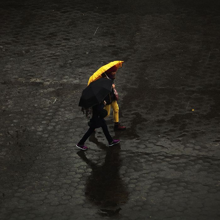 People walk in the rain through Union Square in Manhattan on November 26, 2013 in New York City. New York City is preparing for severe weather as a storm that wreaked havoc in the Southwest over the weekend is turning toward the Northeast. Heavy rains and high winds are predicted for Wednesday, Thanksgiving eve, one of the nations busiest travel days.