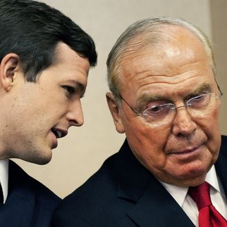 Mormon businessman and philantropist Jon M. Huntsman Sr. (R) listens as his son Former Utah Gov. Jon Huntsman(not seen) announces the suspension of his campaign for the GOP presidential nomination January 16, 2012 and endorses Mitt Romney inside the Myrtle Beach Convention Center in Myrtle Beach, South Carolina. AFP Photo/Paul J. Richards (Photo credit should read PAUL J. RICHARDS/AFP/Getty Images)