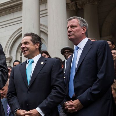 NEW YORK, NY - SEPTEMBER 16: Bill Thompson (L), New York City mayoral hopeful and former New York City comptroller, concedes the Democratic party candidate position to Bill De Blasio (R), during a speech outside New York City Hall on September 16, 2013 in New York City. Thompson and De Blasio both hoped to win the democratic cadidate position for New York City. While De Blasio had a majority lead in the primary vote with approximately 40% of the votes, Thompson had hoped that he could force a run off between the two. New York Governor Andrew Cuomo (C) also attended the speech. (Photo by Andrew Burton/Getty Images)