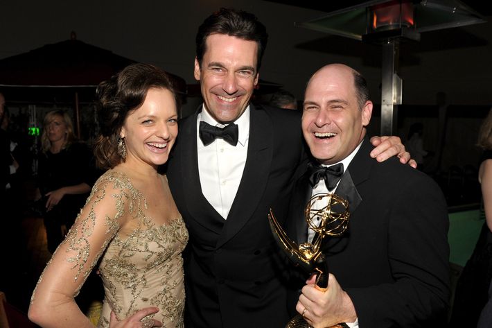 BEVERLY HILLS, CA - SEPTEMBER 18:  (L-R) Actors Elisabeth Moss, Jon Hamm, and producer Matthew Weiner attend the AMC After Party for the 63rd Annual EMMY Awards held at Mr. C Beverly Hills on September 18, 2011 in Beverly Hills, California.  (Photo by John Shearer/Getty Images for AMC)
