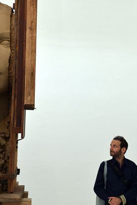 In Room With Broken Sentence, Mark Manders’s installation of sculptures at the Dutch Pavilion, human figures are sandwiched within stacks of timber or fused with items of furniture.