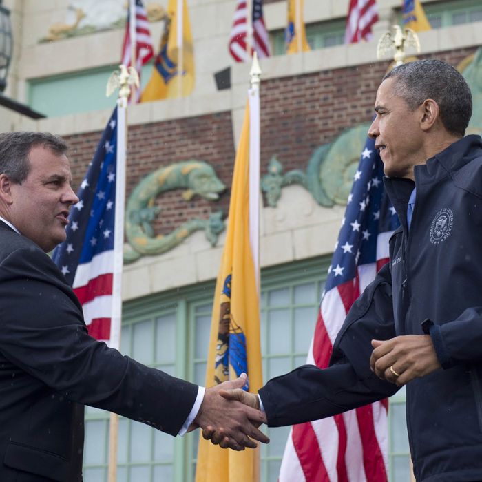 US President Barack Obama shakes hands with New Jersey Governor Chris Christie (L) before speaking about rebuilding efforts following last year's Hurricane Sandy at the Asbury Park Convention Hall in Asbury Park, New Jersey, on May 28, 2013
