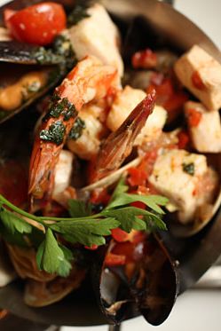 With roasted tomato broth, shrimp, mussels, clams, market-fresh fish, and grilled sourdough bread