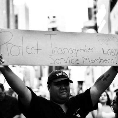 A protester in front of the US Army career center in Times Square on July 26, the day Trump announced that transgender people may not serve 
