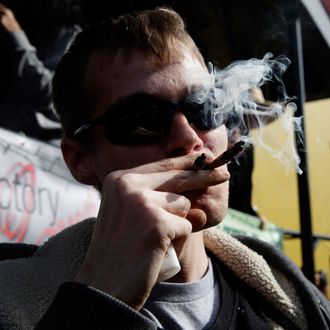 Anthony Nitowski smokes two joints outside at Hempfest on April 20, 2014 in Seattle, Washington. Seattle Hempfest is an annual event for the purpose of educating the public about the benefits of marijuana and advocating for its decriminalization. 