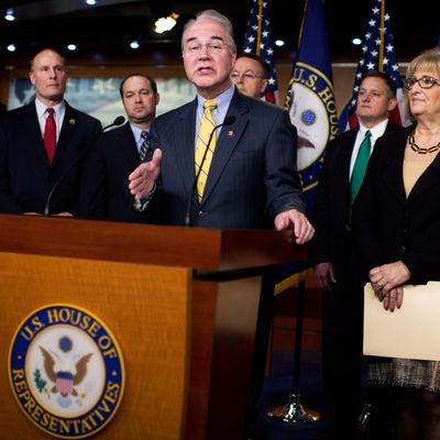 UNITED STATES - MARCH 17: Rep. Tom Price, R-Ga., chairman of the House Budget Committee, conducts a news conference in the Capitol Visitor Center to introduce the FY2016 budget resolution and discuss ways to balance the budget, March 17, 2015. Also appearing from left are Reps. Rob Woodall, R-Ga., John Moolenaar, R-Mich., Marlin Stutzman, R-Ind., Rod Blum, R-Iowa, Bruce Westerman, R-Ark., Diane Black, R-Tenn., Todd Rokita, R-Ind., and Dave Brat, R-Va., (Photo By Tom Williams/CQ Roll Call)