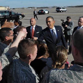 US President Barack Obama greets well-wishers upon his arrival at Bradley Air National Guard Base in Hartford, Connecticut on April 8, 2013. Obama is in Hartford to speak on gun control at the University of Hartford. AFP PHOTO/Mandel NGAN (Photo credit should read MANDEL NGAN/AFP/Getty Images)
