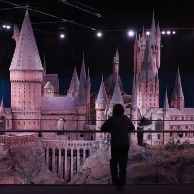 LONDON, ENGLAND - MARCH 23: A visitors looks at a model of 'Hogwarts Castle' at the Harry Potter Studio Tour at Warner Brothers Leavesden Studios on March 23, 2012 in London, England. The studio, which includes the actual sets and special effects departments where the films were created and shot, goes on public display on March 31, 2012. (Photo by Dan Kitwood/Getty Images)