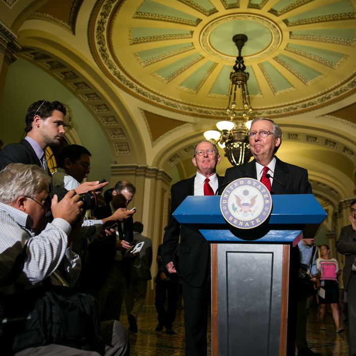  Senate Minority Leader Mitch McConnell (R-KY) (R) and U.S. Sen. Lamar Alexander (R-TN) give a press conference after meeting with fellow Republican Senators on Capitol Hill, July 9, 2013 in Washington, DC. The senators fielded questions about student loan legislation.