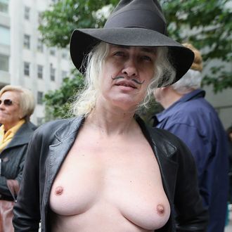 Topless nudity activist Holly Van Voast poses during the annual Columbus Day Parade on October 8, 2012 in New York City. The Italian-American parade was launched in 1929 and is billed as the world’s largest celebration of Italian-American heritage featuring more than 35,000 participants. 