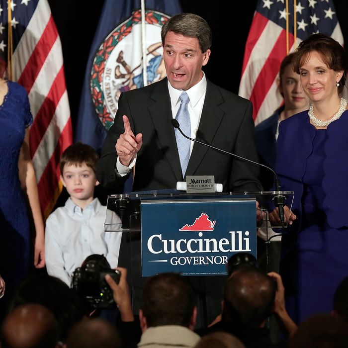 Virginia Attorney General Ken Cuccinelli, appearing with his wife Teiro and family, concedes the Virginia Governor's race to Terry McAuliffe during an election night appearance before supporters November 5, 2013 in Richmond, Virginia. Cuccinelli became the first state attorney general to file a lawsuit against the Affordable Care Act when it was passed in 2010. 