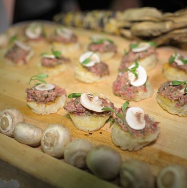 Arlington Club's filet mignon steak tartare with white mushrooms, condiment, and grilled country bread.