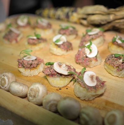 Arlington Club's filet mignon steak tartare with white mushrooms, condiment, and grilled country bread.