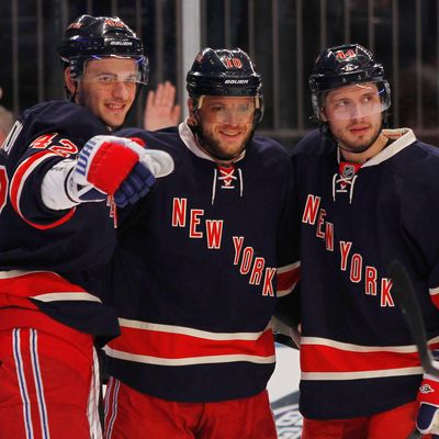 Marian Gaborik #10 of the New York Rangers celebrates a second period goal with teammates Steve Eminger #44 and Artem Anisimov #42 during the game against the Florida Panthers at Madison Square Garden on December 11, 2011 in New York City.